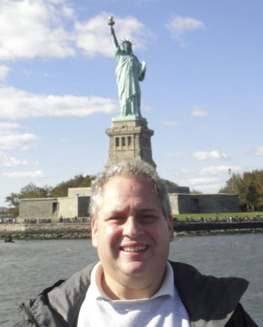 Joe Tandle in New York with one of his restored Motion Performance Corvettes